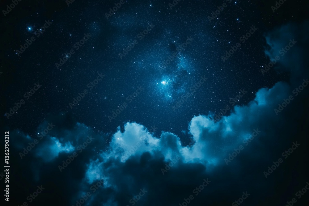 Fototapeta premium Night sky filled with stars and clouds over a serene landscape captures the beauty of the universe