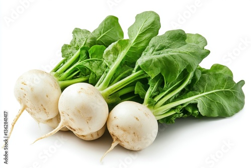 Fresh white radishes with vibrant green leaves on a clean white background ready for culinary use or gardening