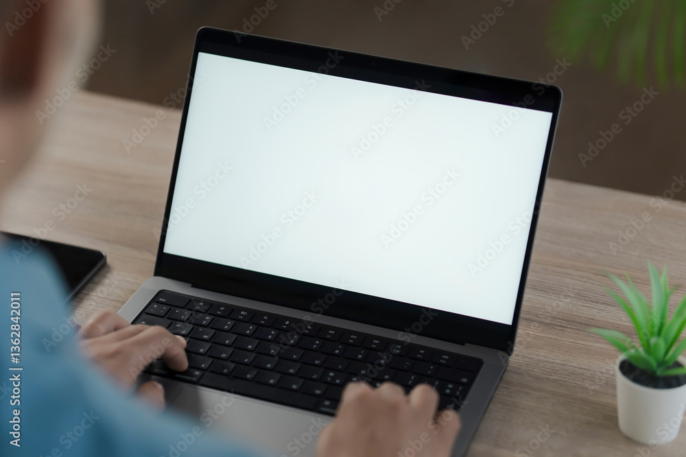 Mockup blank screen computer with blank white background. hand man using laptop contact. advertising text, blank screen laptop, white table with white wall background Mockup blank screen computer with blank white background. hand man using laptop contact. advertising text, blank screen laptop, white table with white wall background