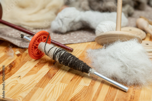 Traditional drop spindle and wool for hand spinning techniques