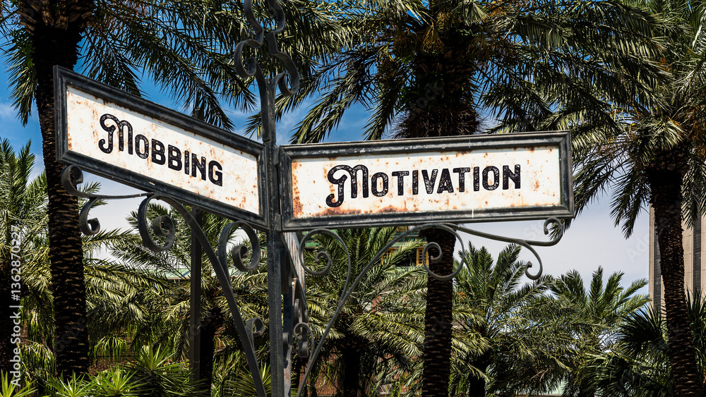 Fototapeta premium Signposts the direct way to motivation versus bullying