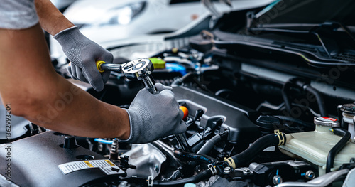 Car care maintenance and servicing, Hand technician auto mechanic checking inspection list after fix or repairing change spare part car engine problem and car insurance service support assistance.