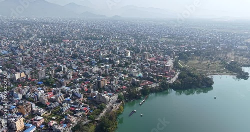 aerial shot overlooking the city of Pokhara, Nepal, situated beside the distinctive Phewa Lake