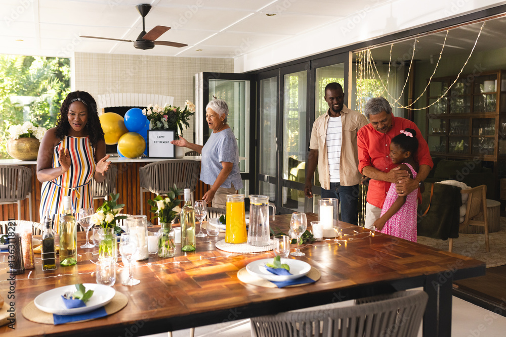 Diverse family celebrating together , enjoying festive meal and joyful moments, in garden Diverse family celebrating together , enjoying festive meal and joyful moments, in garden