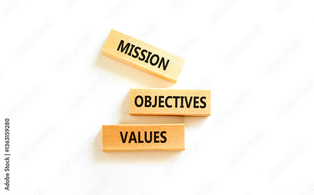 Mission objectives values symbol. Concept words Mission Objectives Values on beautiful blocks. Beautiful white table white background. Business mission objectives values concept. Copy space. Mission objectives values symbol. Concept words Mission Objectives Values on beautiful blocks. Beautiful white table white background. Business mission objectives values concept. Copy space.