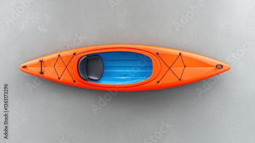 A vibrant orange racing kayak with blue interior rests on a neutral gray background providing ample copy space ideal for text or placement perfect for brochures or website