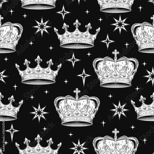 Vintage seamless pattern with medieval crowns, stars. Zigzag arranged objects on black background.