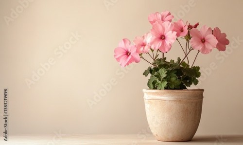 Wallpaper Mural A small pink flower pot with a pink flower in it sits on a table Torontodigital.ca