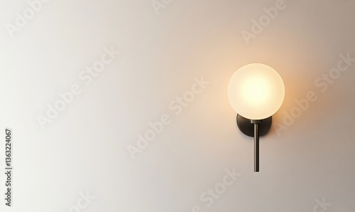 A wall mounted light fixture with a white ball in the center