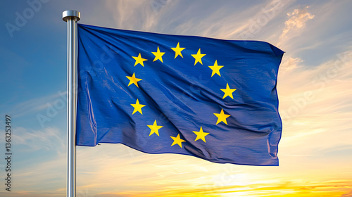 The flag of the European Union waving gently in the breeze against a clear blue sky, symbolizing unity and cooperation among European nations.

