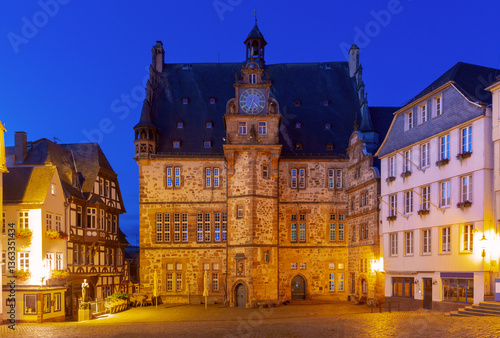 Obraz na płótnie Historic town hall on the illuminated market square in Marburg Germany with surrounding buildings w salonie