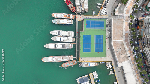 Obraz na płótnie Aerial drone top view photo of tennis court built by waterfront inside port w salonie