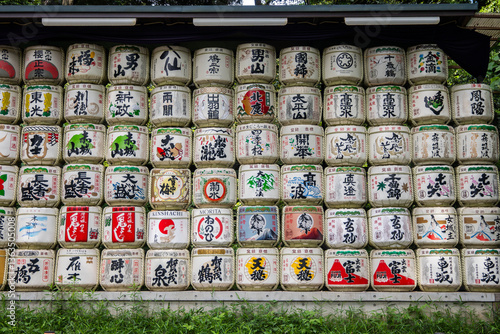 Принти на полотні Stacked sake barrels, kazaridaru form an artistic display at Meiji Jingu Shrine in Tokyo, Japan