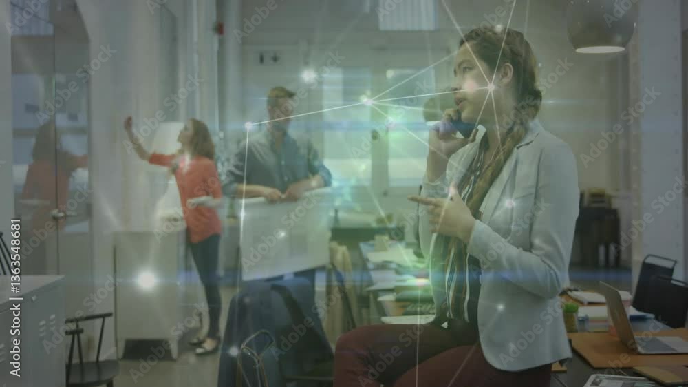 Businesswoman on phone in office with network connections animation overlay Businesswoman on phone in office with network connections animation overlay