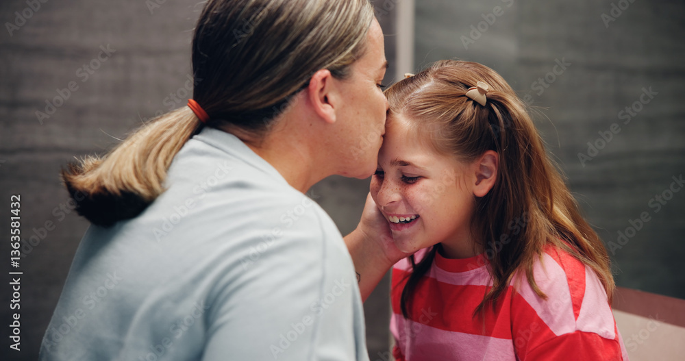 Fototapeta premium Mother, child and kiss on forehead in home for love, support and daughter bonding together with parent. Mom, girl and affection with kid for care, connection and happiness with family for motherhood