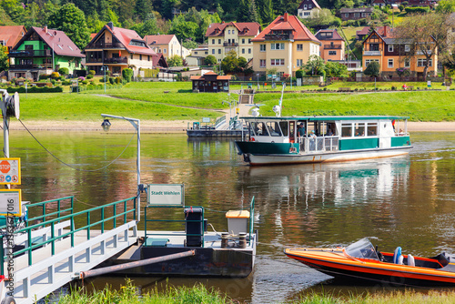 Scenic view old ferry boat cruising Elbe river Whelen Sachsische Schweiz National Park Germany mountain valley on summer sunny day. Europe travel nature landscape destination
