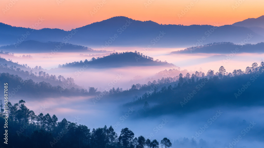 Obraz premium Majestic Mountain Peaks Emerging from the Clouds