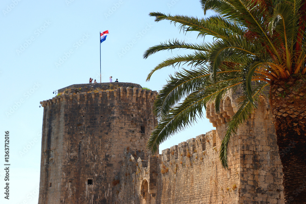 Historical Kamerlengo Fortress in Trogir, Croatia and Croatian flag.