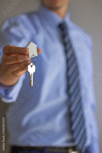 portrait handing over keys tie