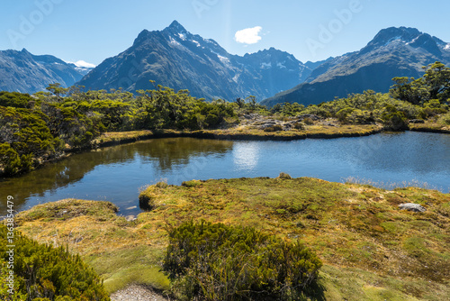 Mountain lake and reflection in Fjordland, New Zealand