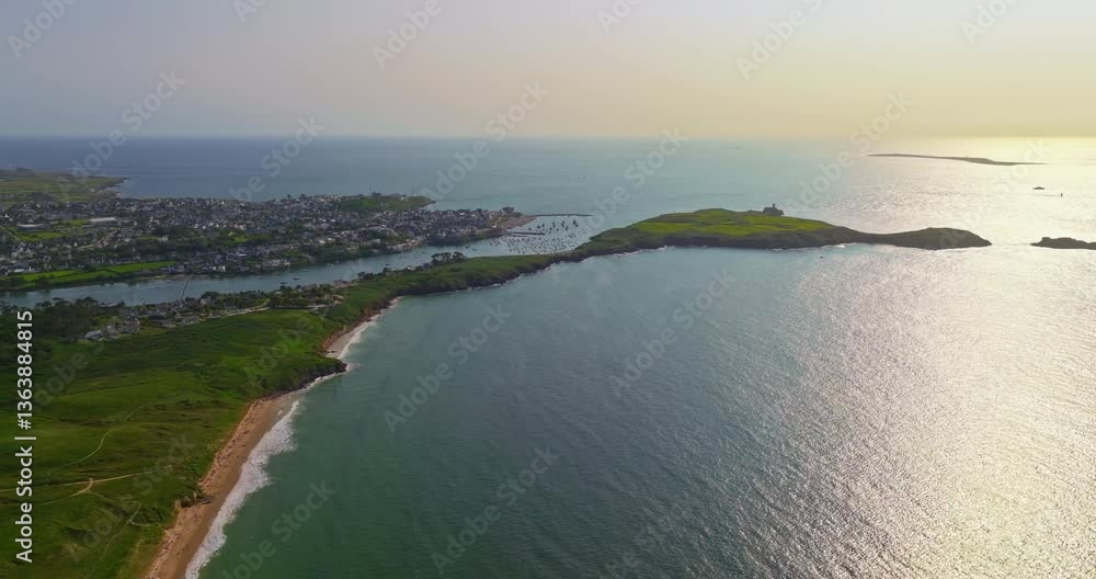 Aerial view of amazing rocky coast of the atlantic ocean in France at sunset. Establishing shot of Bretagne. Drone flying up above the rocks with waves crashing on them in North Brittany Aerial view of amazing rocky coast of the atlantic ocean in France at sunset. Establishing shot of Bretagne. Drone flying up above the rocks with waves crashing on them in North Brittany