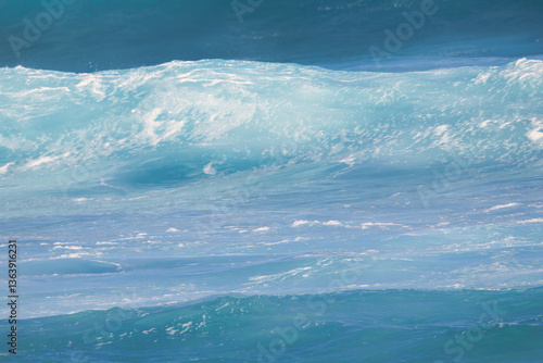 Shades of blue in a wave about to break on a maui shore.