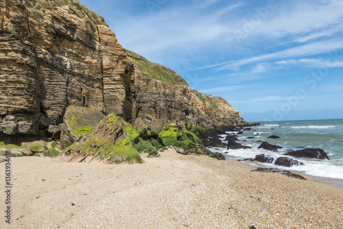 Coastal cliffs, rocks and sand