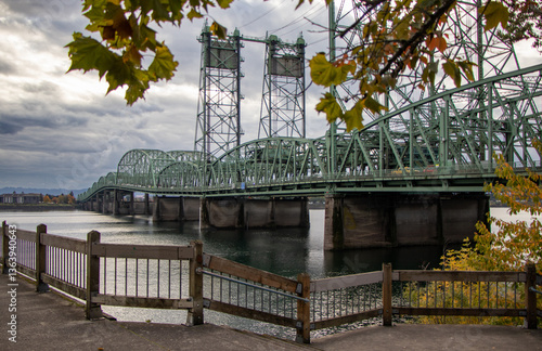The I-5 Bridge spanning across the Columbia River and connecting Oregon and Washington state, as seen from a waterfront walkway in Vancouver, Washington, USA