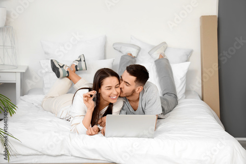 Young couple with keys and ...