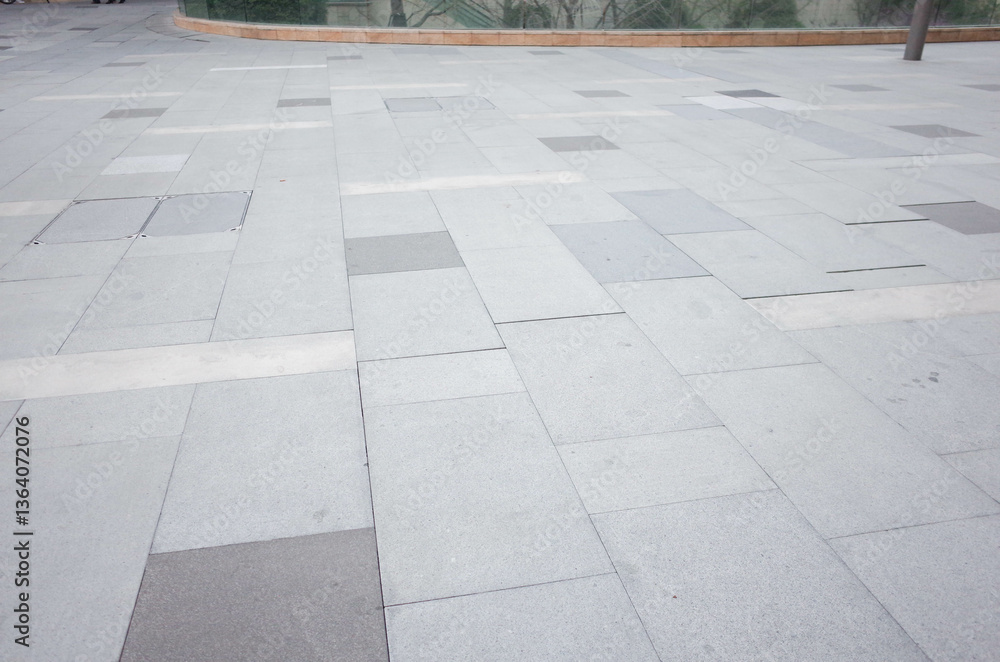 Grey brick stone street road. Light sidewalk, pavement texture. Granite outdoor tiled floor.