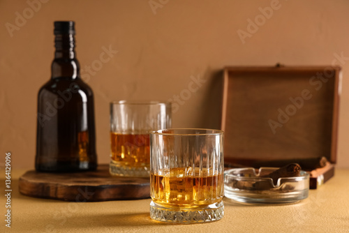 Whiskey bottle and two glas...