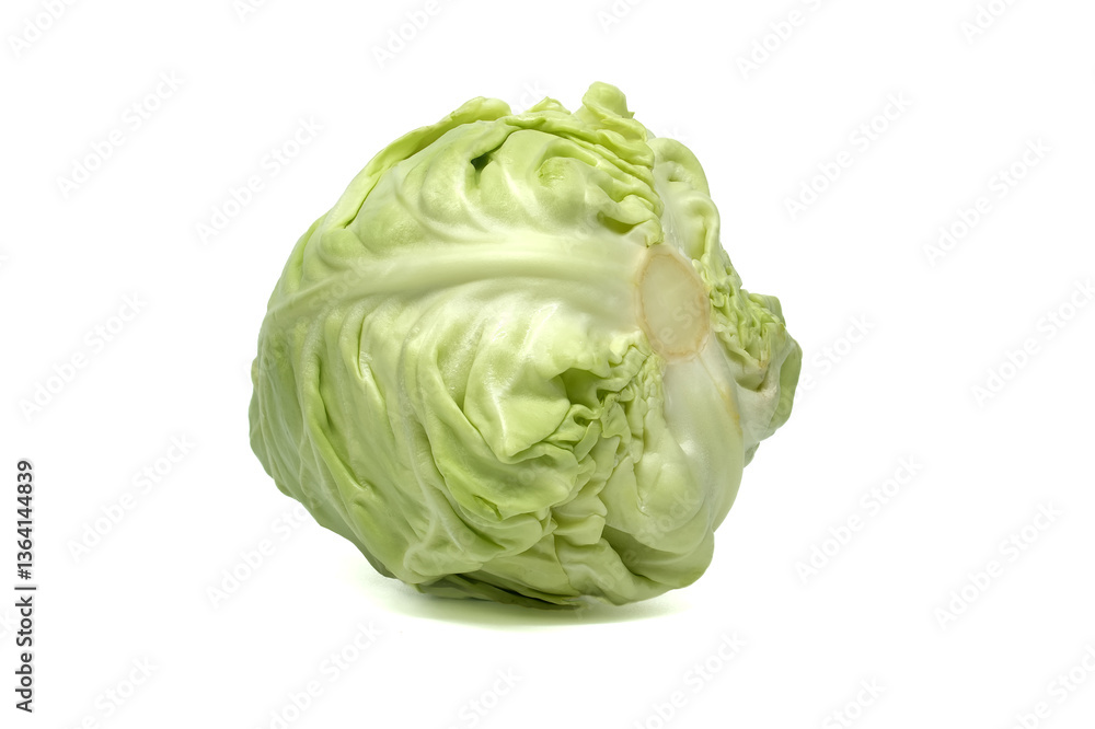 Close-up of a fresh, whole head of green cabbage isolated on a bright white background. Close-up of a fresh, whole head of green cabbage isolated on a bright white background.
