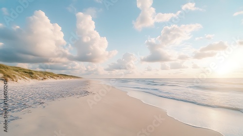 Serene sunset beach scene with soft sand and gentle waves.