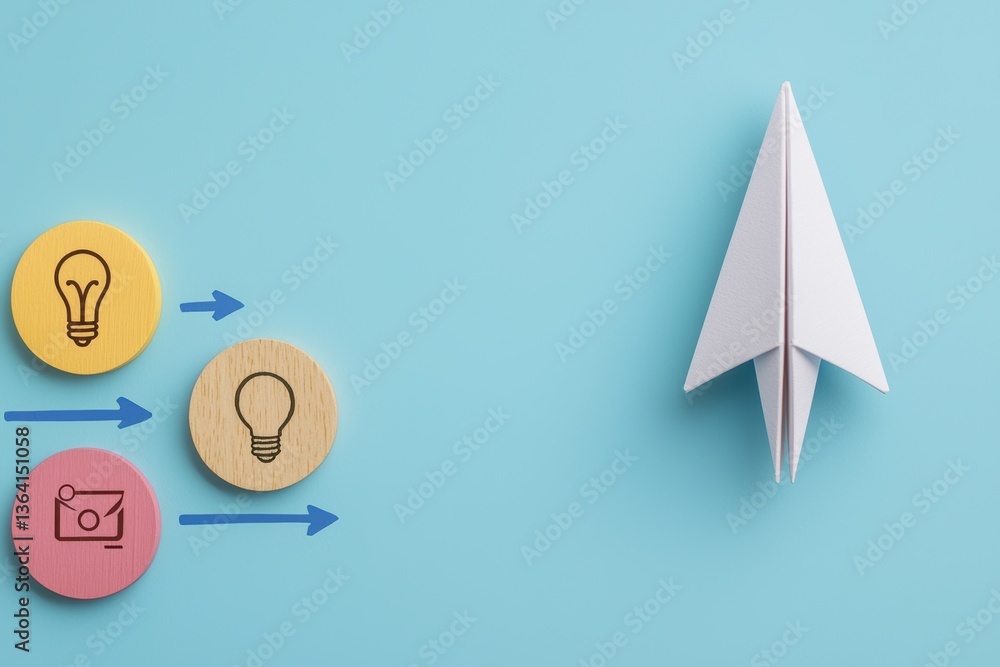 Paper Airplane Near Colorful Wooden Tokens With Lightbulb Icons Representing Innovation And Creativity Paper Airplane Near Colorful Wooden Tokens With Lightbulb Icons Representing Innovation And Creativity