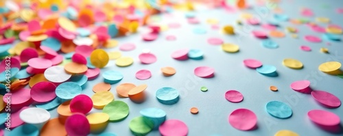 Colorful confetti background with scattered vibrant colored paper pieces,  party,  birthday