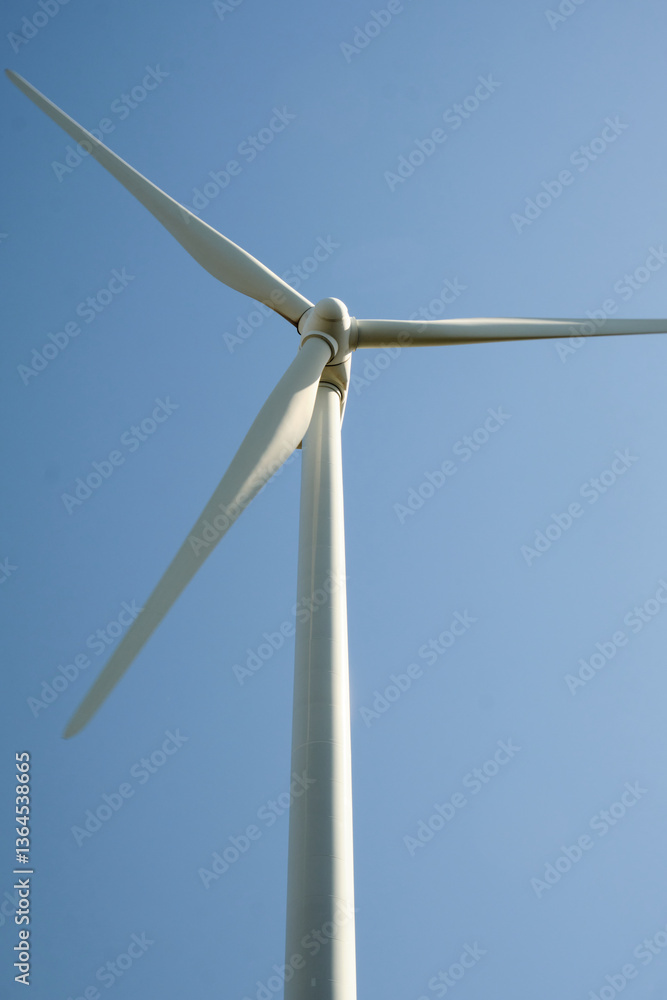 Wind turbine with blue sky at background Wind turbine with blue sky at background