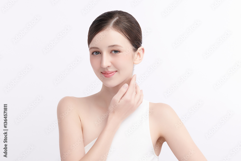 A beautiful young woman with clean, fresh skin against a white background. Skincare, facial treatment, cosmetology, beauty, and spa. An elegant portrait of an woman.