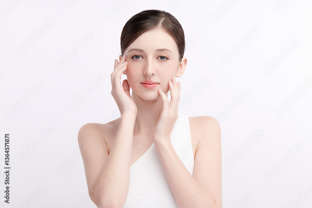 A beautiful young woman with clean, fresh skin against a white background. Skincare, facial treatment, cosmetology, beauty, and spa. An elegant portrait of an woman. A beautiful young woman with clean, fresh skin against a white background. Skincare, facial treatment, cosmetology, beauty, and spa. An elegant portrait of an woman.