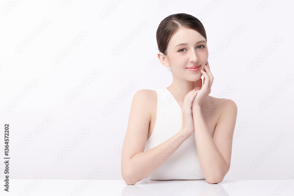 A beautiful young woman with clean, fresh skin against a white background. Skincare, facial treatment, cosmetology, beauty, and spa. An elegant portrait of an woman. A beautiful young woman with clean, fresh skin against a white background. Skincare, facial treatment, cosmetology, beauty, and spa. An elegant portrait of an woman.