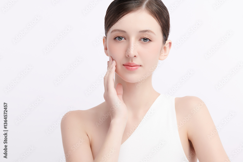 A beautiful young woman with clean, fresh skin against a white background. Skincare, facial treatment, cosmetology, beauty, and spa. An elegant portrait of an woman. A beautiful young woman with clean, fresh skin against a white background. Skincare, facial treatment, cosmetology, beauty, and spa. An elegant portrait of an woman.