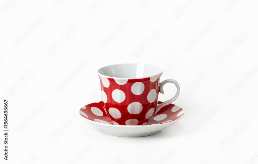 Obraz premium Red cup and saucer with white polka dots on a white background, isolated