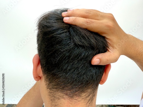 Cuadro en lienzo A man pressing the back of his head, illustrating occipital discomfort or tension-related headache symptoms