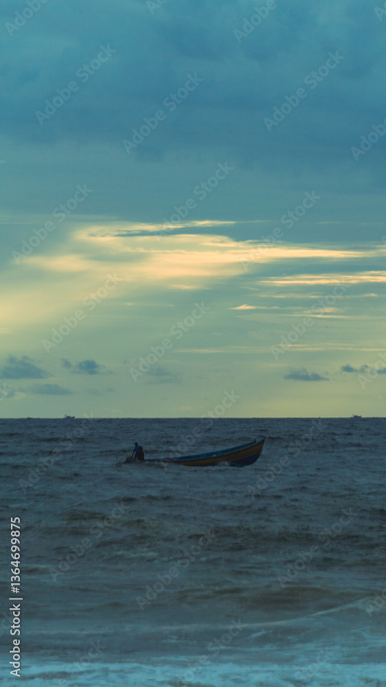 Fototapeta premium fishing boat and beautiful clouds