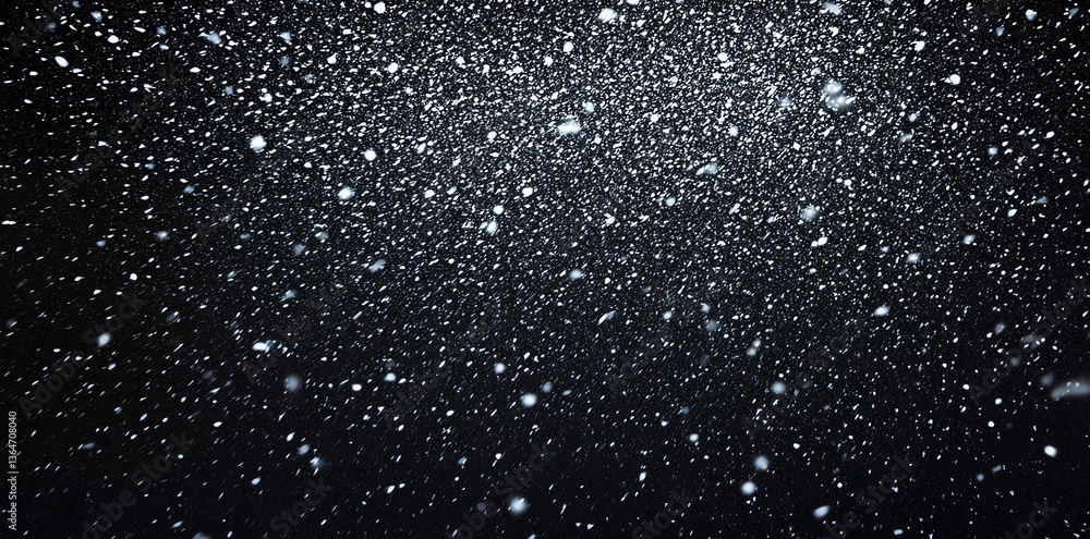 Obraz premium Falling Snowflakes Against Black Sky Creates Dramatic Winter Backdrop