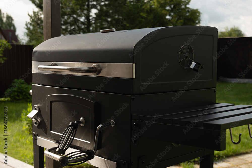 New portable charcoal barbecue grill for summer party at patio. Summer. Outdoors. BBQ grill. Close up.