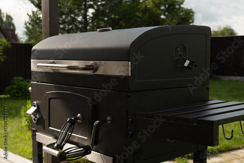 New portable charcoal barbecue grill for summer party at patio. Summer. Outdoors. BBQ grill. Close up.