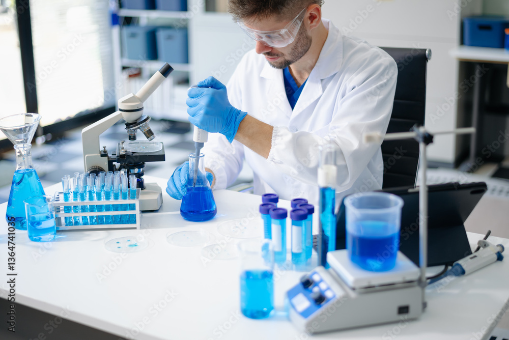 Modern medical research laboratory. male Scientists Conducting Chemistry Research in Laboratory Modern medical research laboratory. male Scientists Conducting Chemistry Research in Laboratory