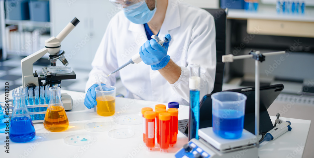 Fototapeta premium scientists in lab coats conducting research, handling glassware, and working with chemicals