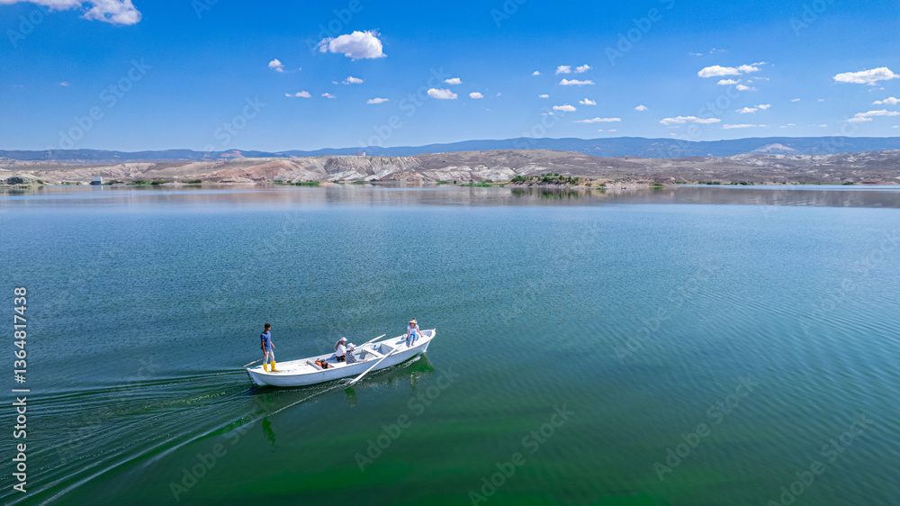 Obraz premium Boats cruising on blue lake Sariyar Dam Mihaliccik Eskisehir Turkey