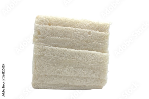 White bread stacked on a plain white background. The bread is square in shape, soft and fluffy in texture, and has a light cream color.